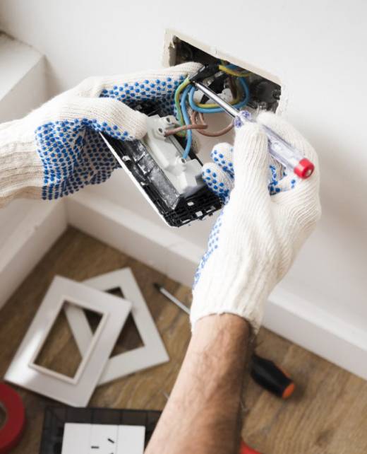 electrician-s-hand-installing-power-socket-homek